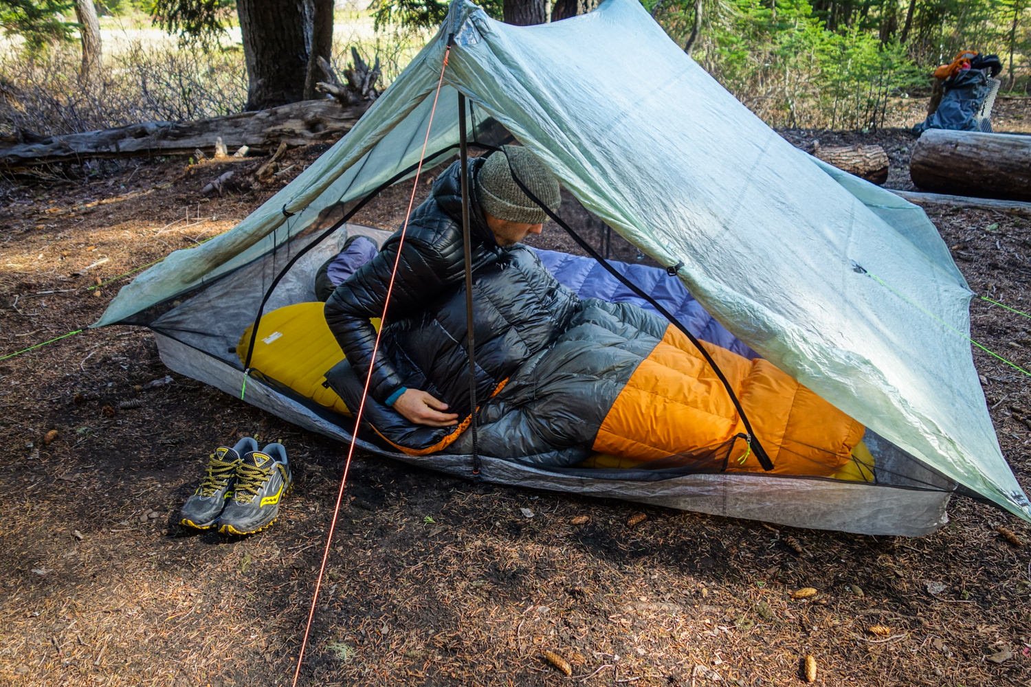 A backpacker using the Therm-a-Rest NeoAir XLite Sleeping Pad
